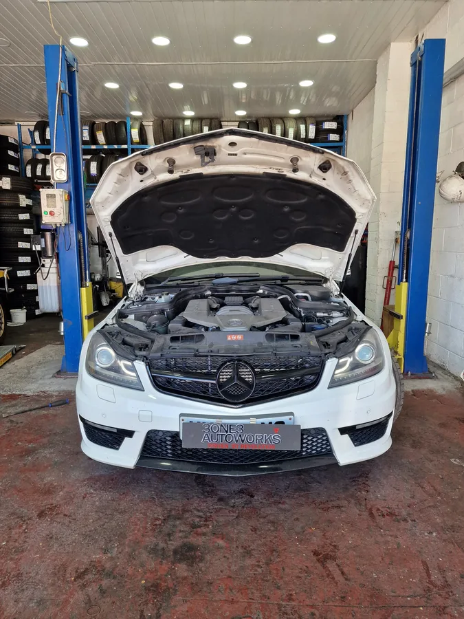 Mercedes W204 C-Class on lift in workshop